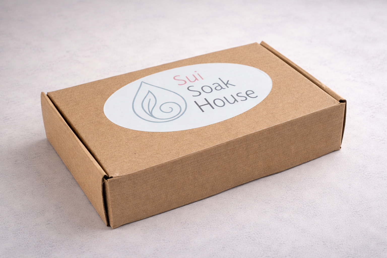Brown cardboard box with 'Sui Soak House' logo on a light gray background